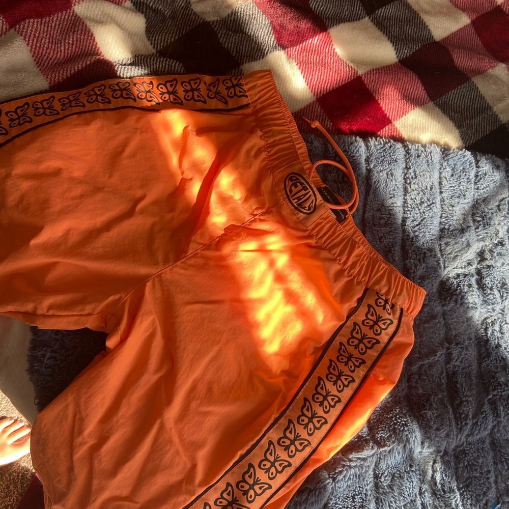 Orange butterfly joggers